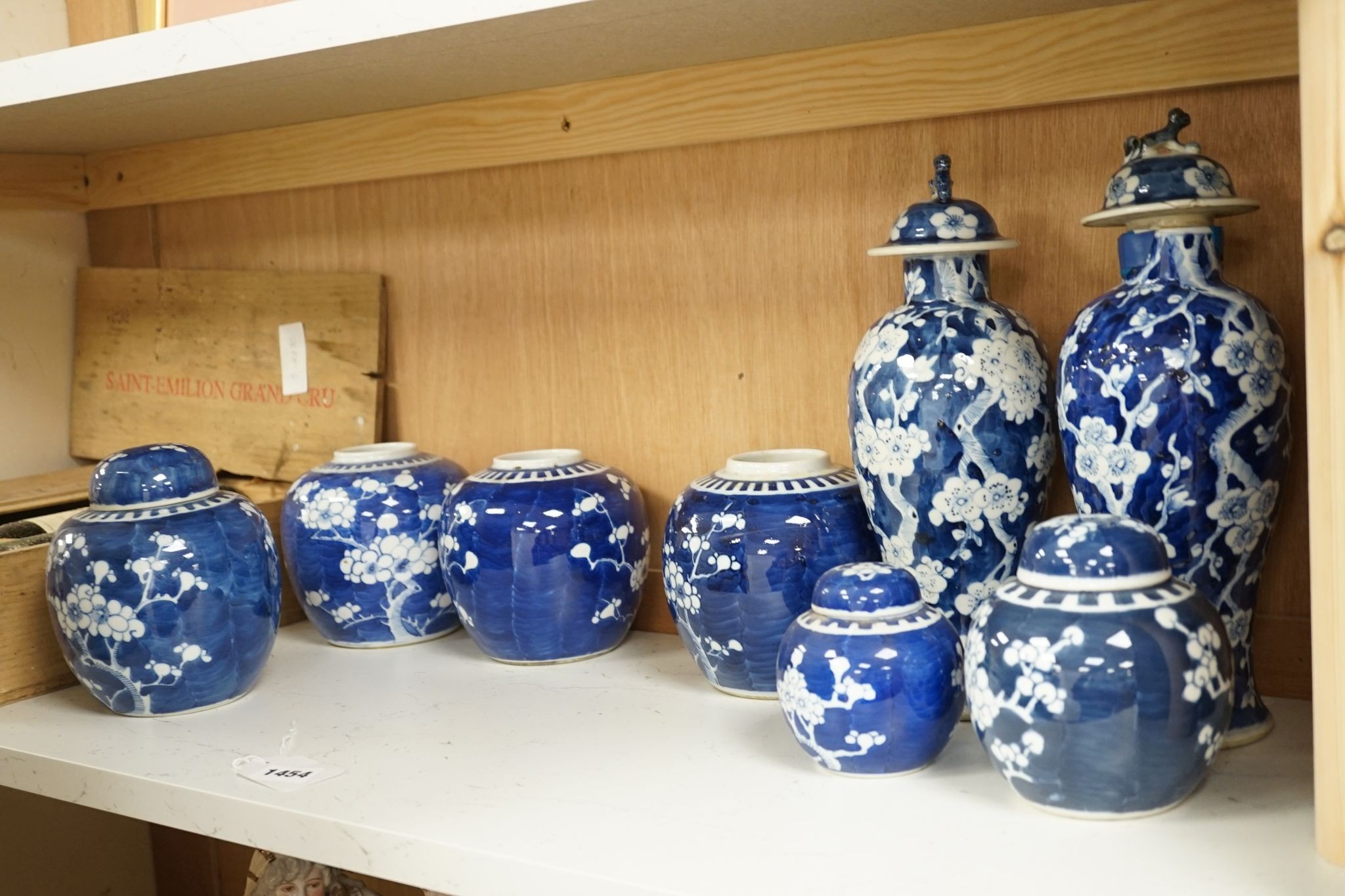A pair of Chinese blue and white vases and eleven jars, six with covers., Vase and matching cover 28 cms high.